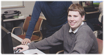 Aaron Curley working at the computer.