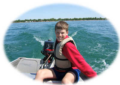 Josiah boating on Lake Huron.
