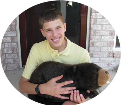 Josiah with his favorite stuffed animal, Buster.