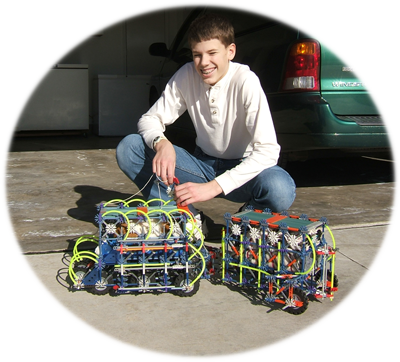 Josiah with one of his k'nex masterpieces: the Guinea Mobile.